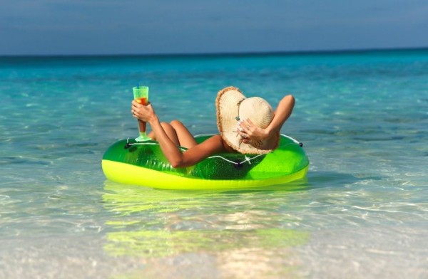 woman relaxing in an innertube at tropical paradise